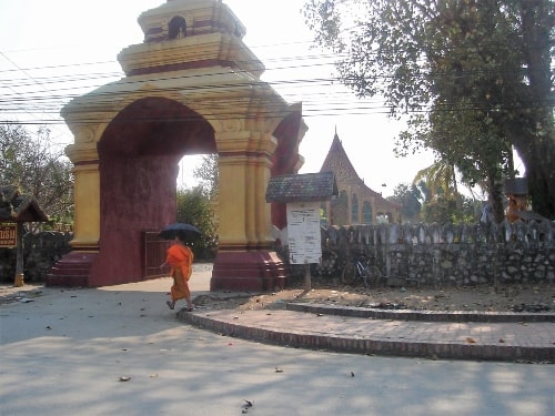 Temple and monk in Laos