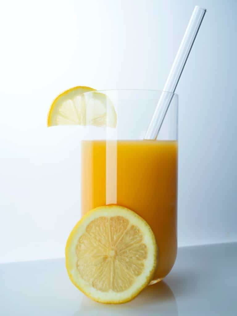 best sources of vitamin d, glass of orange juice with straw