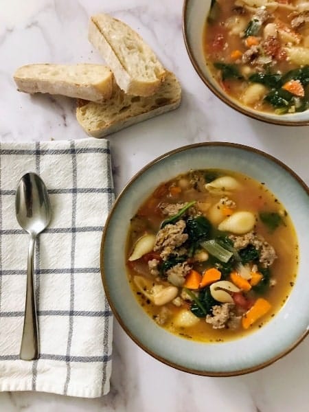 top 5 healthy recipes and nutrition posts in 2021, Italian Sausage and Vegetable Soup in bowls with sliced French bread