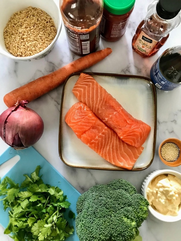 Ingredients in Salmon Buddha Bowl: salmon, carrot, red onion, soy sauce, sriracha, chili garlic sauce, honey, brown rice, sesame seeds, cilantro, broccoli, mayonnaise