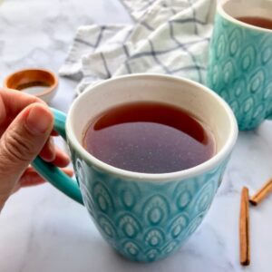 cinnamon tea in teal mug.