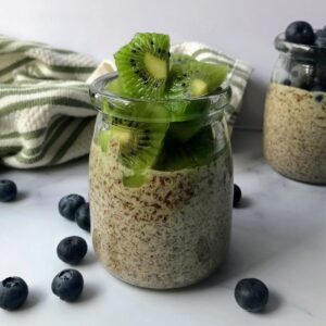 jar of flaxseed pudding topped with fruit.
