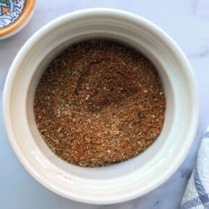 Chicken taco seasoning in a white ramekin.